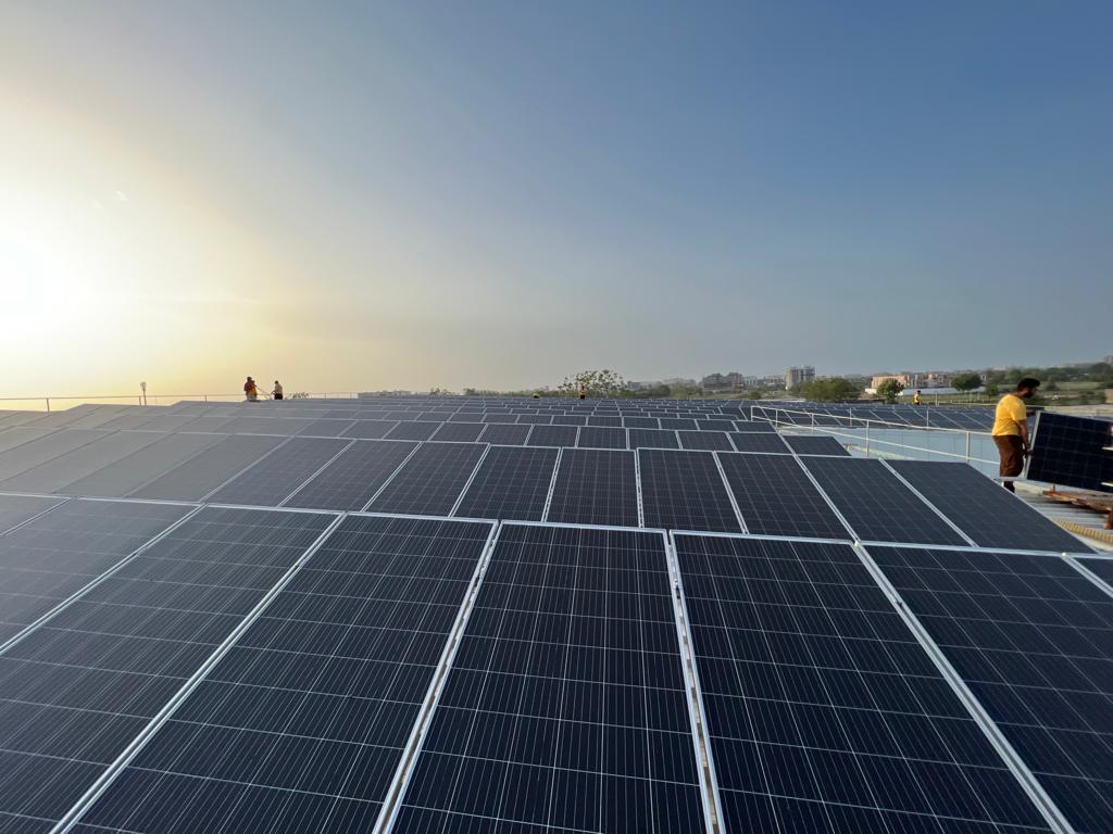 Foreman and businessman at solar energy station